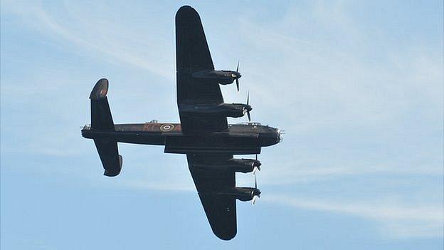 Battle of Britain Memorial Flight Lancaster Bomber flying over Guernsey