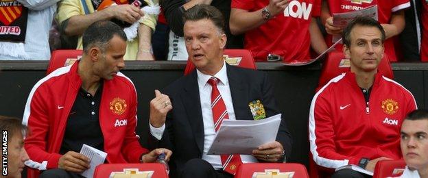 Manchester United manager Louis van Gaal (centre), assistant Ryan Giggs (left) and assistant Albert Stuivenberg (right)