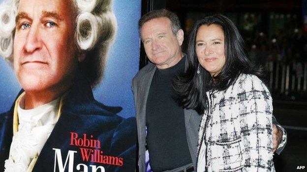 US actor Robin Williams (L) and wife Marsha Garces Williams arriving for the premiere of Universal Pictures "Man of the Year" at Grauman"s Chinese Theatre in the Hollywood section of Los Angeles, California 4 October 2014