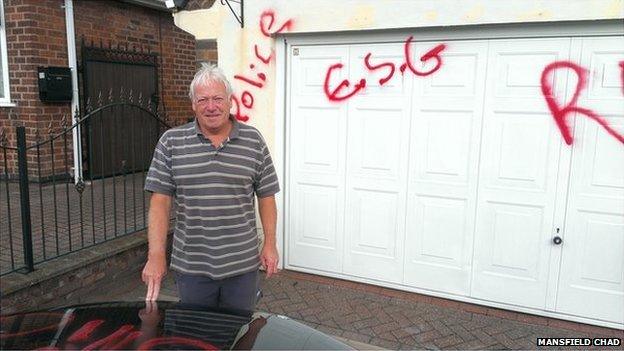 Tony Egginton next to his house and car