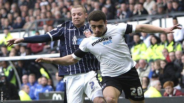 Derby County's Mason Bennett outmuscles Alan Dunne (left) of Millwall