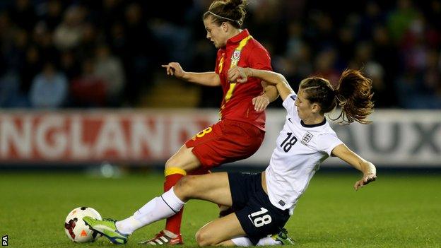 England's Jill Scott tackles Wales' Hayley Ladd