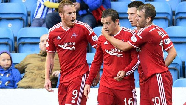 Adam Rooney, Ryan Jack and Niall McGinn congratulate Aberdeen's Peter Pawlett