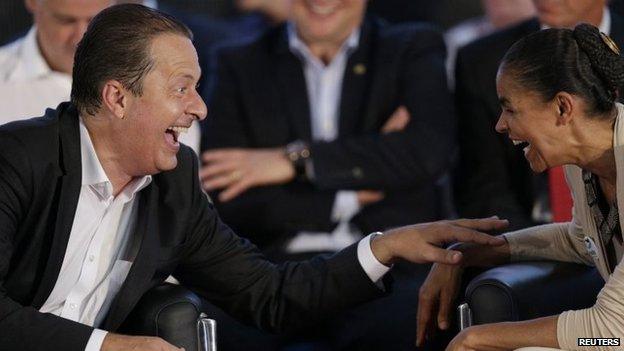 Eduardo Campos laughs with Marina Silva during a ceremony to announce their candidacies for president and vice president of Brazil in Brasilia (14 April 2014)