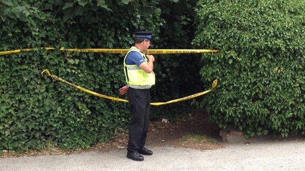 A PCSO at the scene of the investigation