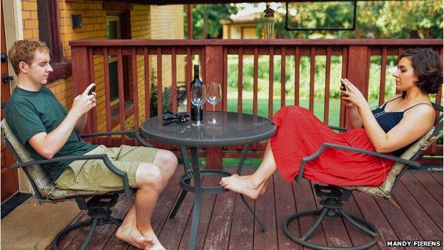 Couple ignoring each other on phones