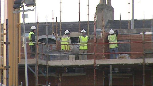 Construction workers at building site