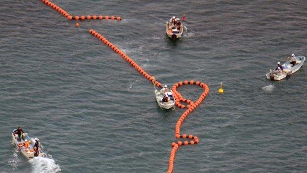 In this aerial photo, workers in boats set up no-go zone in the sea off Nago, Okinawa, southern Japan, Thursday, on 14 Aug 2014