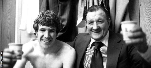 Liverpool's Emlyn Hughes relaxes with Bob Paisley after beating Everton 3-0 in the FA Cup semi-final