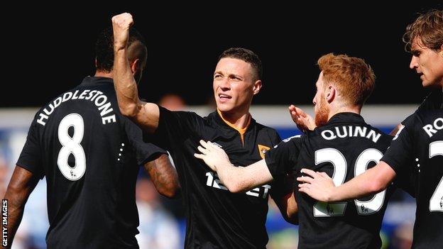 James Chester celebrates scoring Hull's goal at Loftus Road