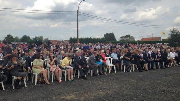 Many people have turned out to watch the unveiling