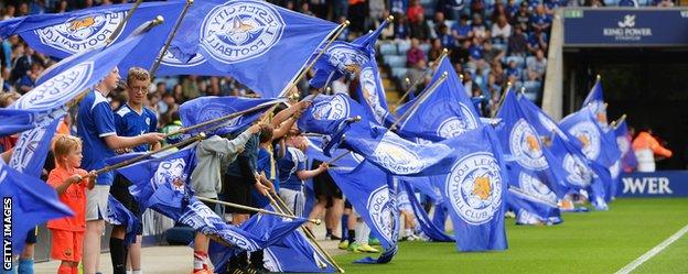 Leicester City fans welcome their team