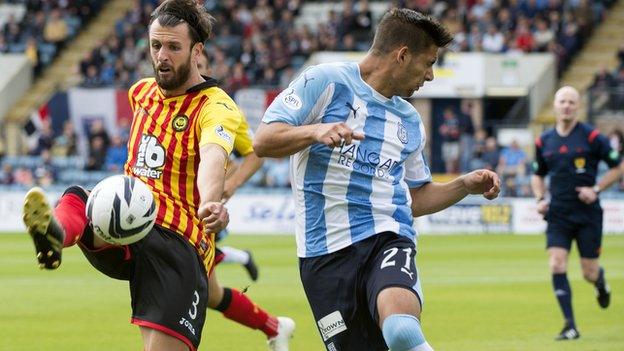 Partick Thistle's Daniel Seaborne clears under pressure from Luka Tankulic (right) of Dundee.