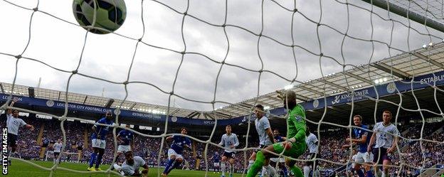 Leonardo Ulloa scores