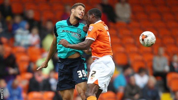 Rudy Gestede and Donervon Daniels jump for a header