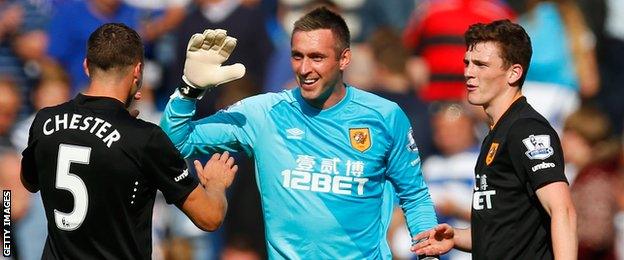 James Chester (right) celebrates with Allan McGregor (centre)