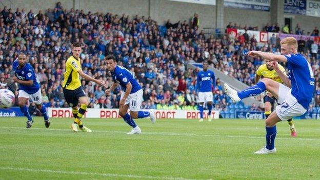 Chesterfield striker Eoin Doyle scores one of his two penalties against Rochdale