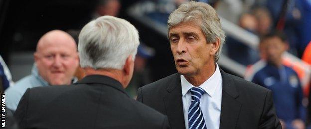 Newcastle manager Alan Pardew and Manchester City manager Manuel Pellegrini