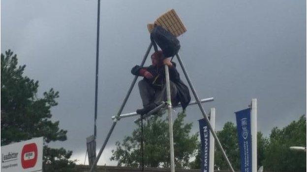 Protester on tripod