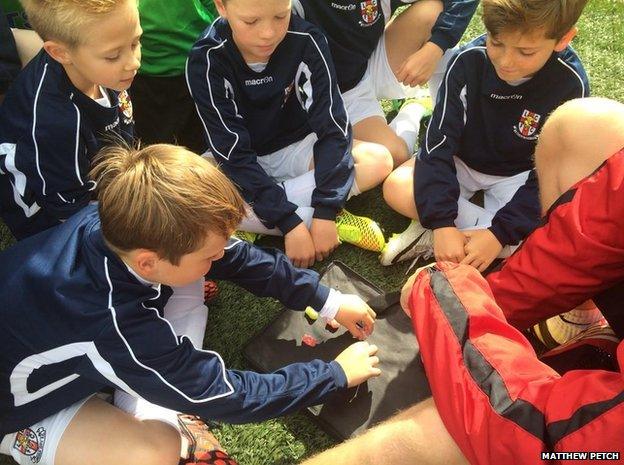 Lincoln City Football Club Youth Academy players with jelly babies