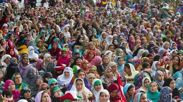 Supporters of Tahirul Qadri, a Pakistani-Canadian cleric, listen to his speech during a sit-in protest for the third day in Islamabad, Pakistan, 17 August 2014