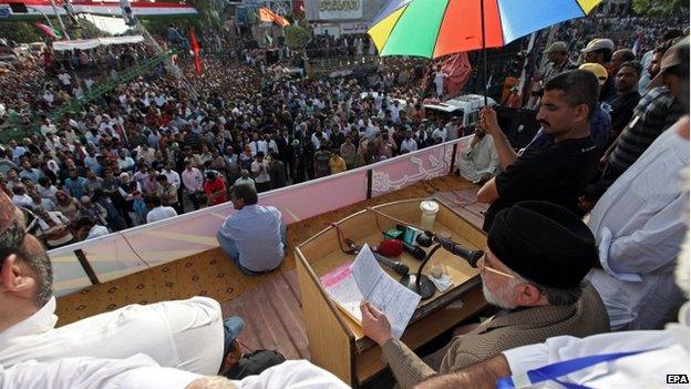 Tahirul Qadri, a Pakistani-Canadian cleric leaves after a speech to his supporters during a sit-in protest for the third day in Islamabad, Pakistan, 17 August 2014