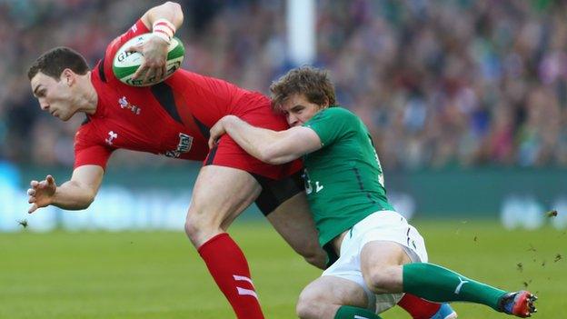 Wales win George North is tackled by Ireland's Andrew Trimble