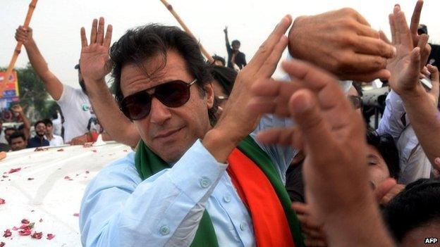 Imran Khan is mobbed by supporters during a protest march in Islamabad - 16 August 2014