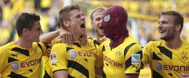 Pierre-Emerick Aubameyang celebrates a goal in a Spiderman mask