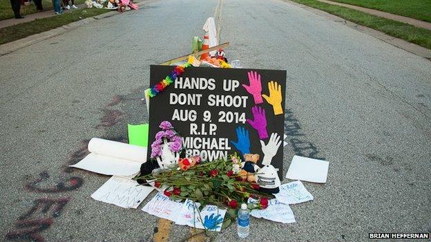 A makeshift memorial of posters, flowers and candles honouring Michael Brown in Ferguson, Missouri