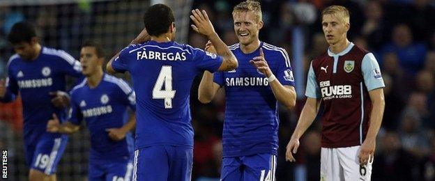 Cesc Fabregas and Andre Schurrle celebrate