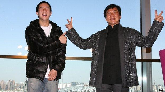 Hong Kong entertainer Jackie Chan (R) poses with his son Jaycee Fong Jo Ming as they take part in a press conference for Chan's concert at Beijing's Bird's Nest stadium, the centrepiece of the 2008 Olympic Games, in Beijing on 1 April, 2009