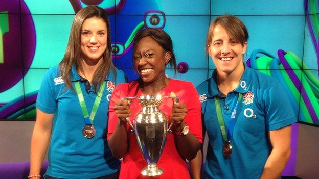 Katy Maclean, Ayshah and Sarah Hunter with Women's Rugby World Cup trophy