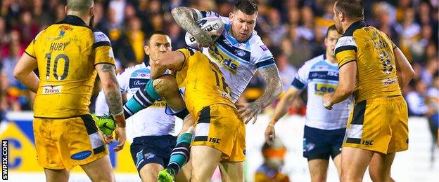 Leeds' Brett Delaney is tackled by Castleford's Oliver Holmes