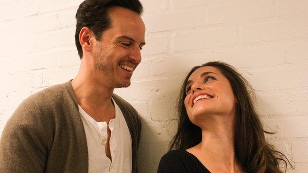 The two actors during production, looking at each other