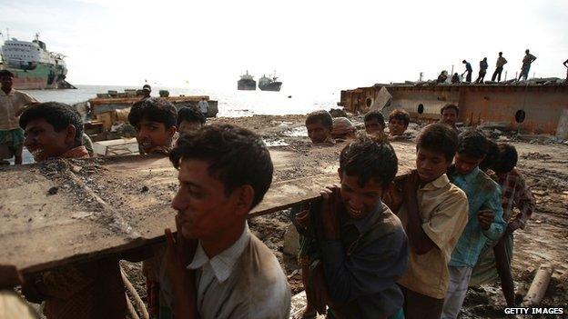 Workers breaking up a ship in the port city of Chittagong, Bangladesh