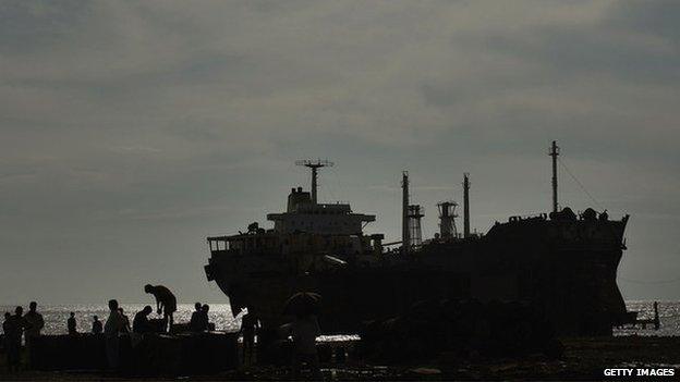 A ship is dismantled for scrap in the port city of Chittagong, Bangladesh