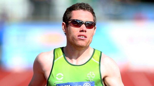 Jason Smyth crosses the line to win the T12 100m in Swansea on Tuesday