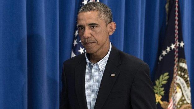 US President Barack Obama leaves after making a statement on the situation in Iraq and in Ferguson, Missouri, at Martha's Vineyard, Massachusetts 14 August 2014