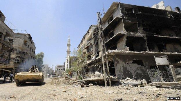 Damaged buildings in Mleiha, in Syria