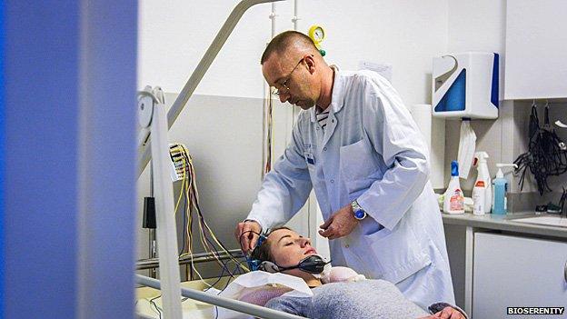 A patient is connected up to an EEG machine to be monitored