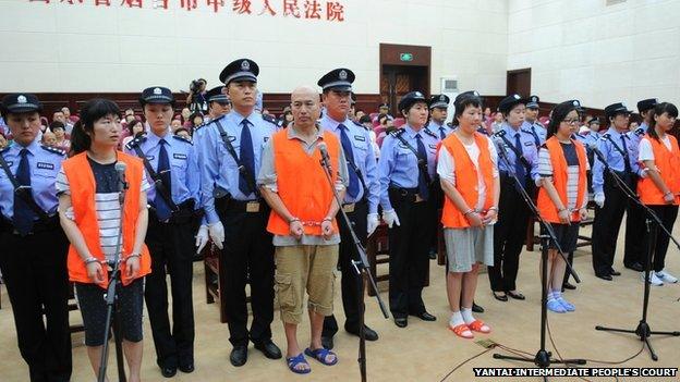 Defendants stands trial in Yantai, Shandong, 21 Aug 2014