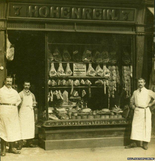 The Hohenrein bothers in front of their shop