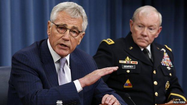 U.S. Secretary of Defense Chuck Hagel (L) speaks next to Chairman of the Joint Chiefs of Staff General Martin Dempsey during a press briefing at the Pentagon in Washington, August 21