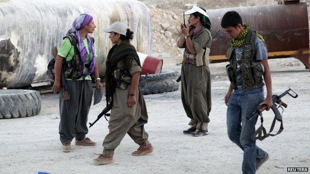 PKK fighters participate in a security deployment against Islamic State (IS) militants on the front line in Makhmur