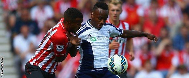 Saido Berahino of West Brom holds off a challenge from Ryan Bertrand of Southampton