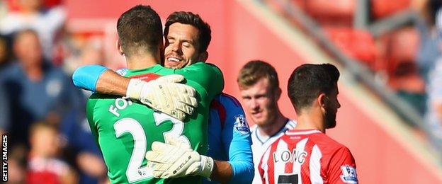 Fraser Forster of Southampton hugs Ben Foster of West Brom