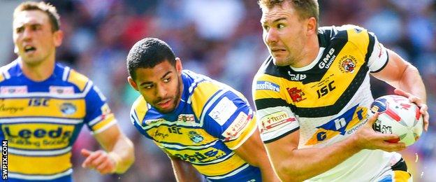 Castleford's Michael Shenton makes a break from Leeds' Kallum Watkin