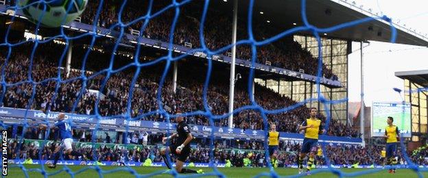 The ball hits the net as Steven Naismith wheels away in celebration