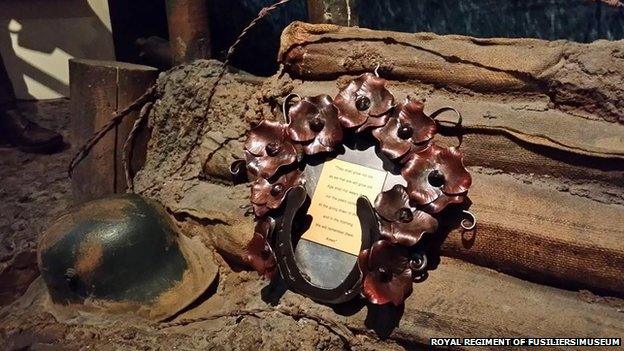 Ironwork wreath and a WW1 helmet